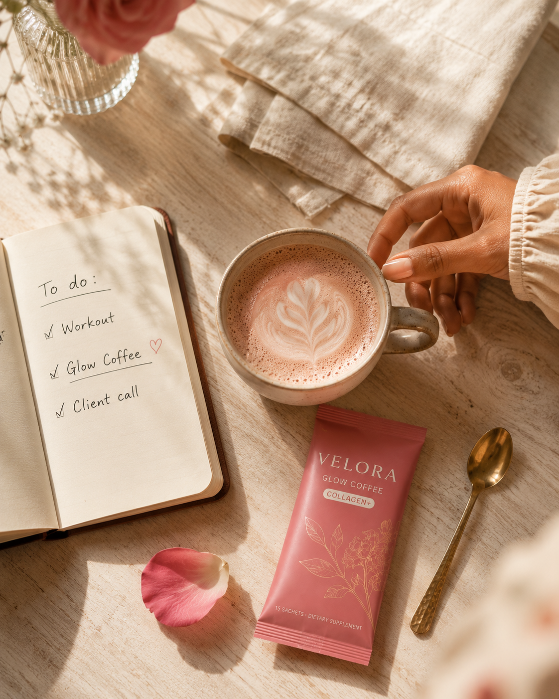 Morning ritual flat-lay with Velora Glow Coffee, journal, latte art, brass spoon